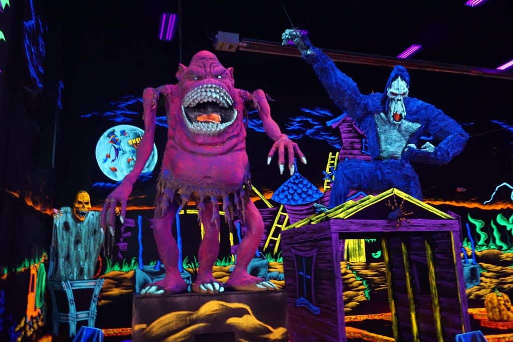 Monster Mini Golf Facilities 8 Giant neon decorations of monsters at a monster mini golf location.