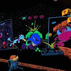 Glowing wall art at monster mini golf