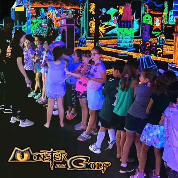 Monster Mini Golf Facilities 10 A line of kids celebrating a birthday party at monster mini golf.